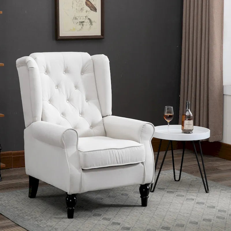 Fauteuil d'appoint capitonné avec dossier haut à oreilles, accoudoirs rembourrés arrondis et assise épaisse rembourrée