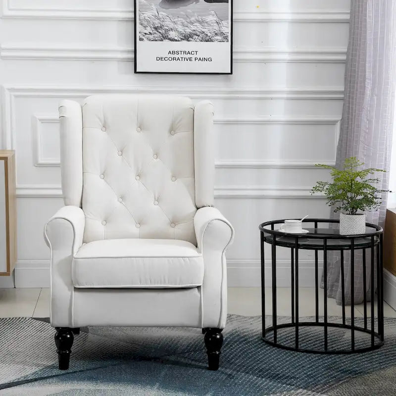 Fauteuil d'appoint capitonné avec dossier haut à oreilles, accoudoirs rembourrés arrondis et assise épaisse rembourrée