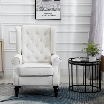 Fauteuil d'appoint capitonné avec dossier haut à oreilles, accoudoirs rembourrés arrondis et assise épaisse rembourrée