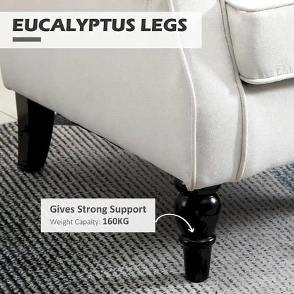 Fauteuil d'appoint capitonné avec dossier haut à oreilles, accoudoirs rembourrés arrondis et assise épaisse rembourrée