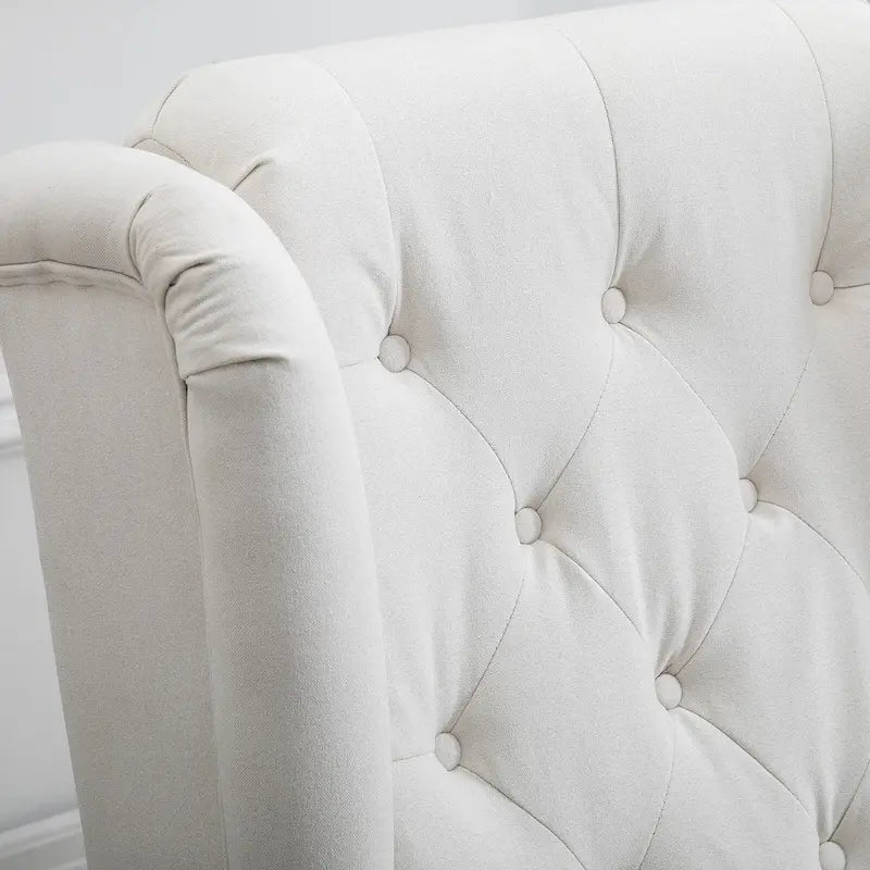 Fauteuil d'appoint capitonné avec dossier haut à oreilles, accoudoirs rembourrés arrondis et assise épaisse rembourrée