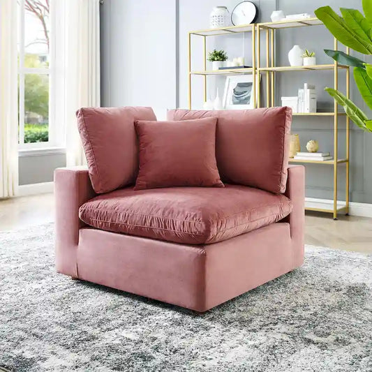 Fauteuil d'angle Commix en velours performant, rembourré de duvet et ultra-confortable
