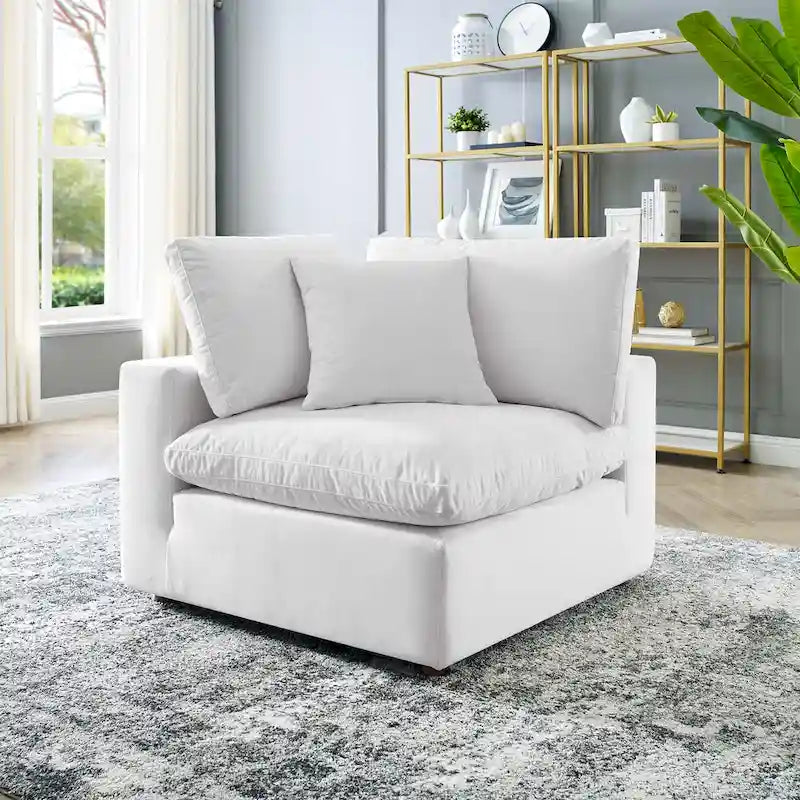 Fauteuil d'angle Commix en velours performant, rembourré de duvet et ultra-confortable