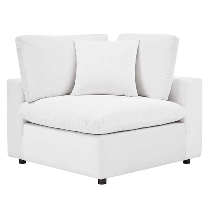 Fauteuil d'angle Commix en velours performant, rembourré de duvet et ultra-confortable
