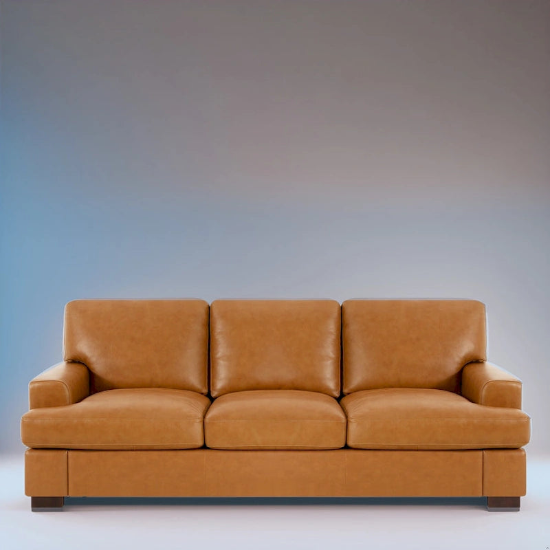 Canapé 3 places haut de gamme en cuir véritable, avec assise profonde et moelleuse et coussins en plumes d'oie pour un confort optimal.